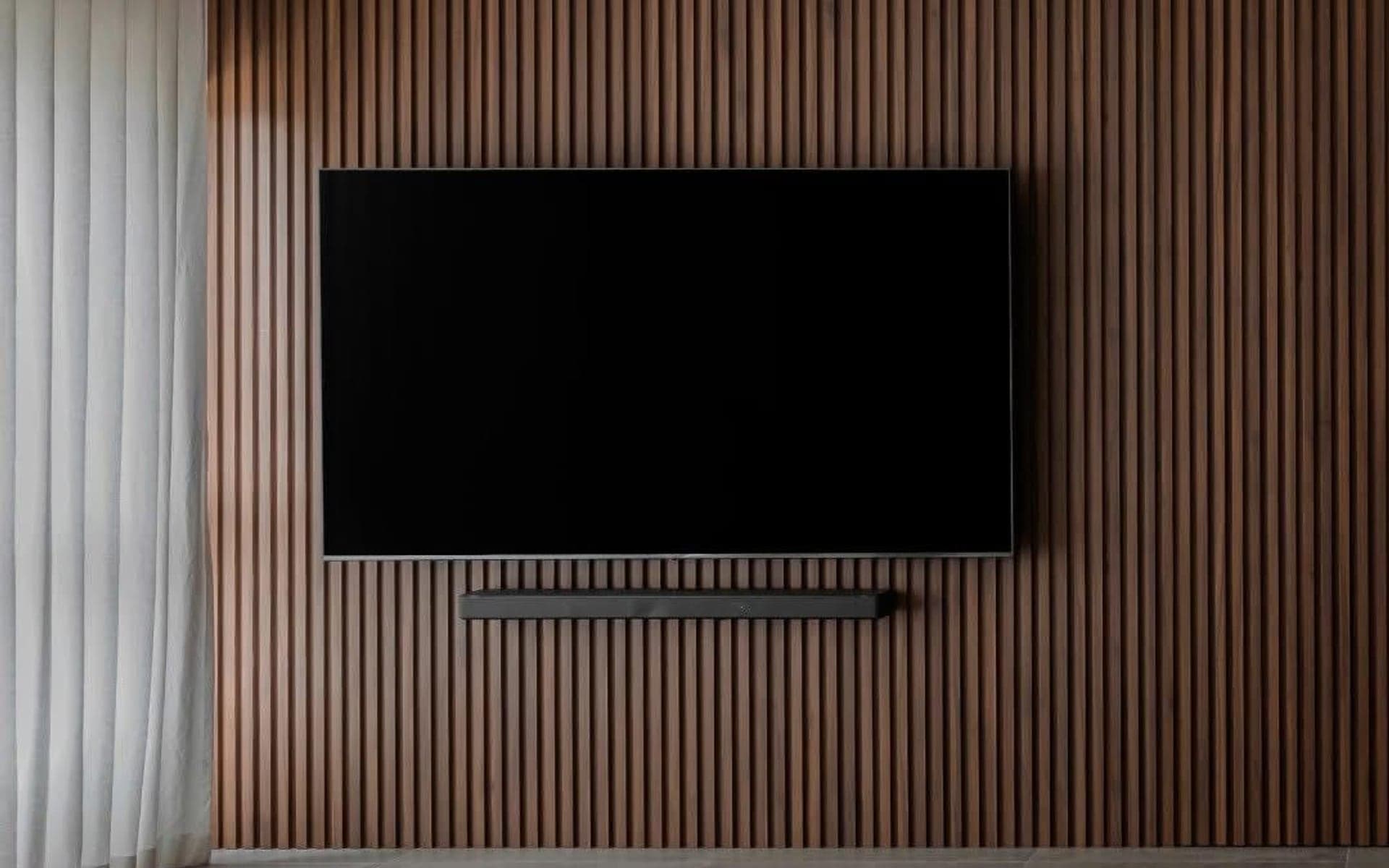 Condo interior TV feature wall and living area finish